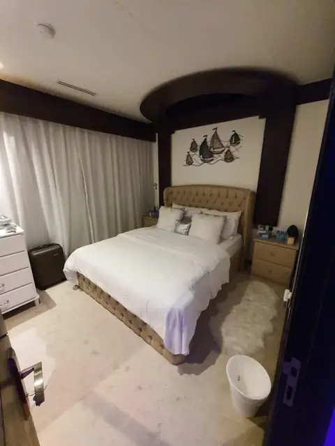 Master bedroom with tufted headboard